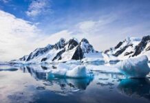 Permanent U.S. Foothold Upsets Moscow Icebergs floating before snow-covered mountains under a bright sky