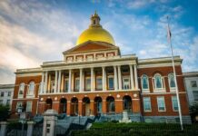 City Playbook Triggers Federal Probe Massachusetts State House with golden dome and columns