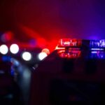 Night Chaos Slams Small-Town Georgia Police car light bar flashing red and blue at night