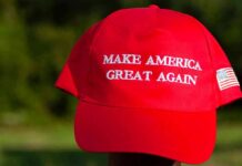 MAGA Hat Buyers Exposed In Data Sweep Red baseball cap with political slogan and small U.S. flag patch