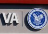 Free Help Exists – Why Are Vets Paying? VA logo and Department of Veterans Affairs seal on building wall
