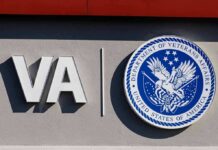Free Help Exists – Why Are Vets Paying? VA logo and Department of Veterans Affairs seal on building wall