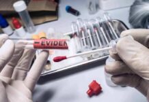 Two Ole Miss Deaths Share A Disturbing Link Gloved hands handling a swab and evidence tube