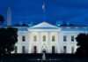Bomb Threat Email Rattles White House White House illuminated at dusk with flagpole and columns