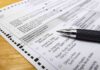 LA Admits: No Citizenship Check Ballot paper with pen on wooden surface