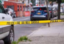 Police tape cordons off a city street
