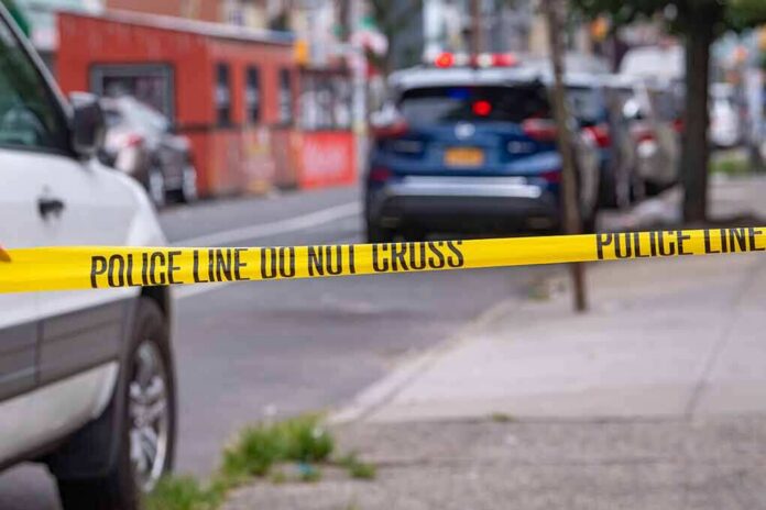 shutterstock_2018131463 Police tape cordons off a city street