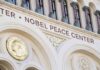 Nobel Peace Center facade with arched windows and gold medallion