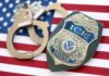 Mayor-Elect Sparks ICE Uproar ICE officer badge and handcuffs on an American flag