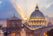 Vatican On Edge: Pope Heads To OR St. Peter's Basilica dome at sunset with glowing sky