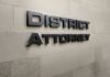 Judge Flags Perjury – DA Ousted District Attorney office wall sign