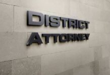 Judge Flags Perjury – DA Ousted District Attorney office wall sign