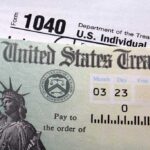 Close-up of a U.S. Treasury check and tax form 1040