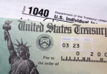 White House Refunds Hit 30 States Close-up of a U.S. Treasury check and tax form 1040